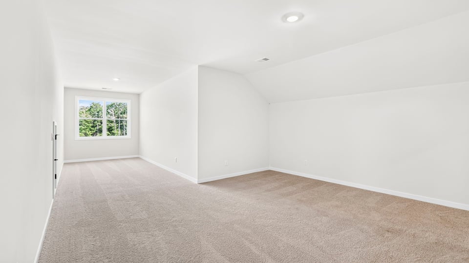 Loft area with carpet.