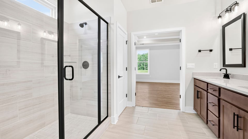 Bathroom with walk in shower and bathtub.