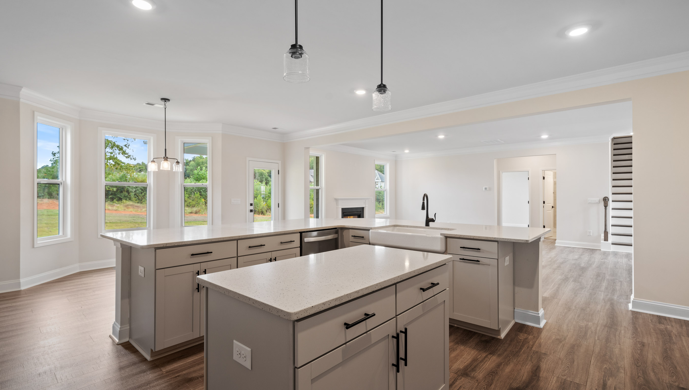 View from kitchen of the breakfast area with lots of windows and natural light.