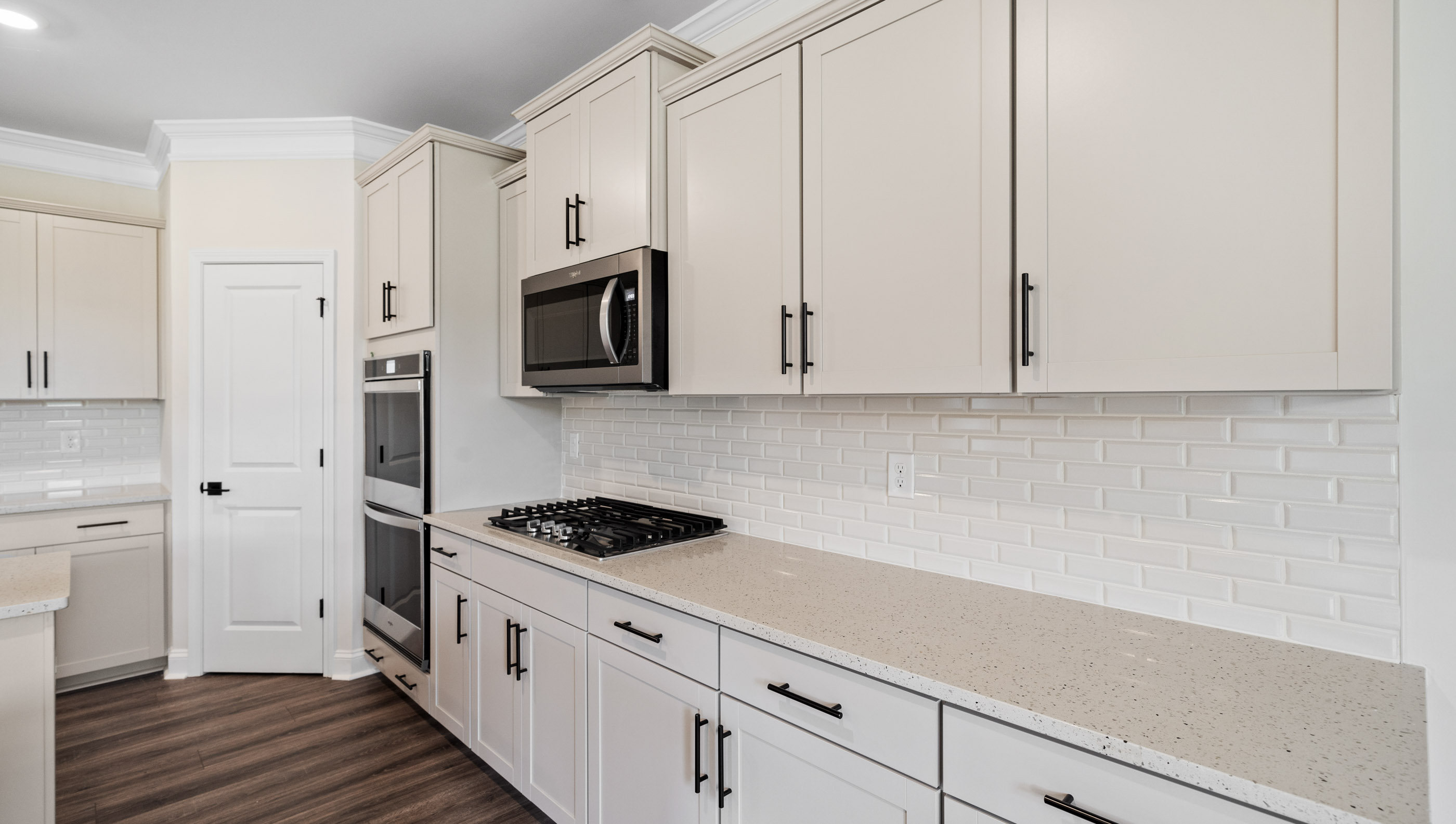 Gas stove top and plenty of cabinets.