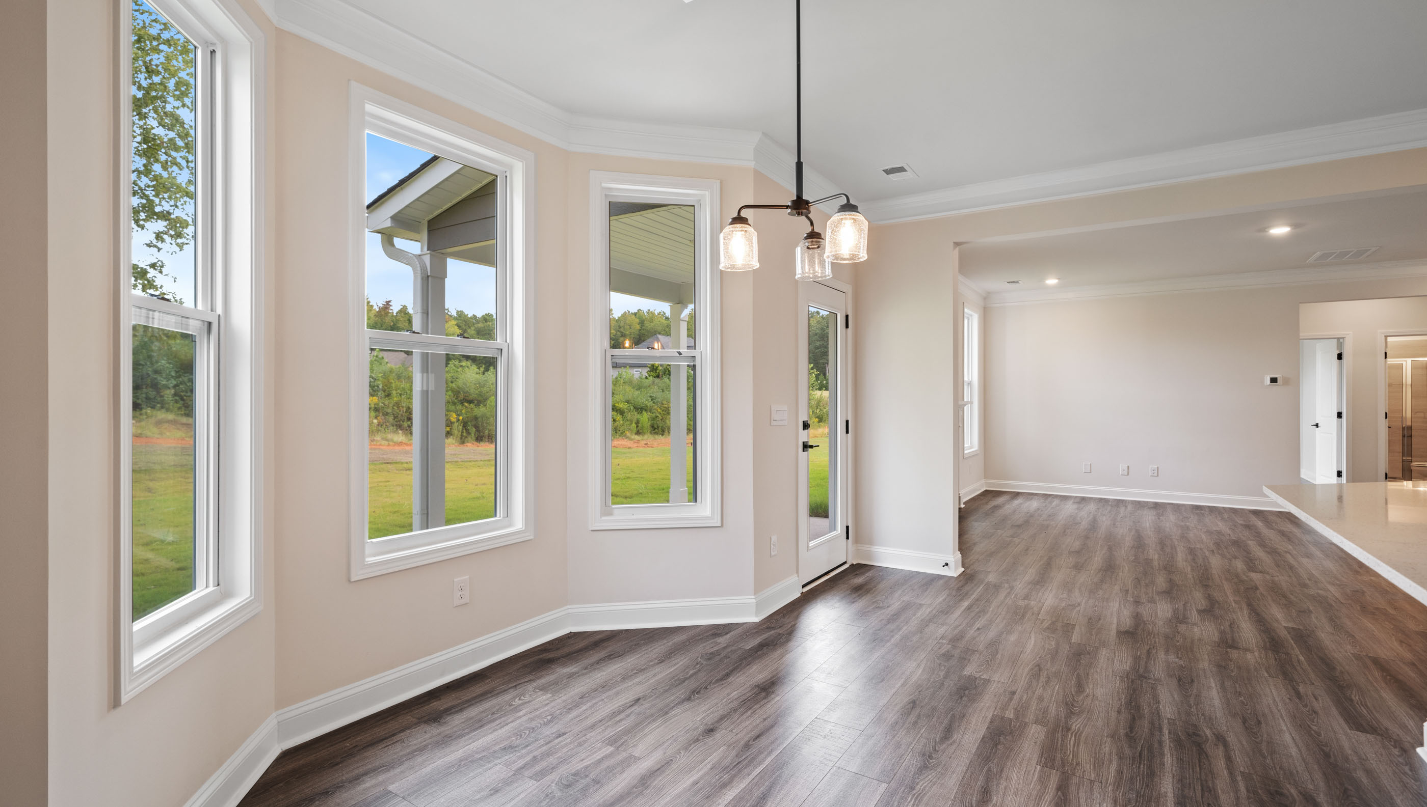 View of the breakfast room with lots of windows overlooking the back yard.