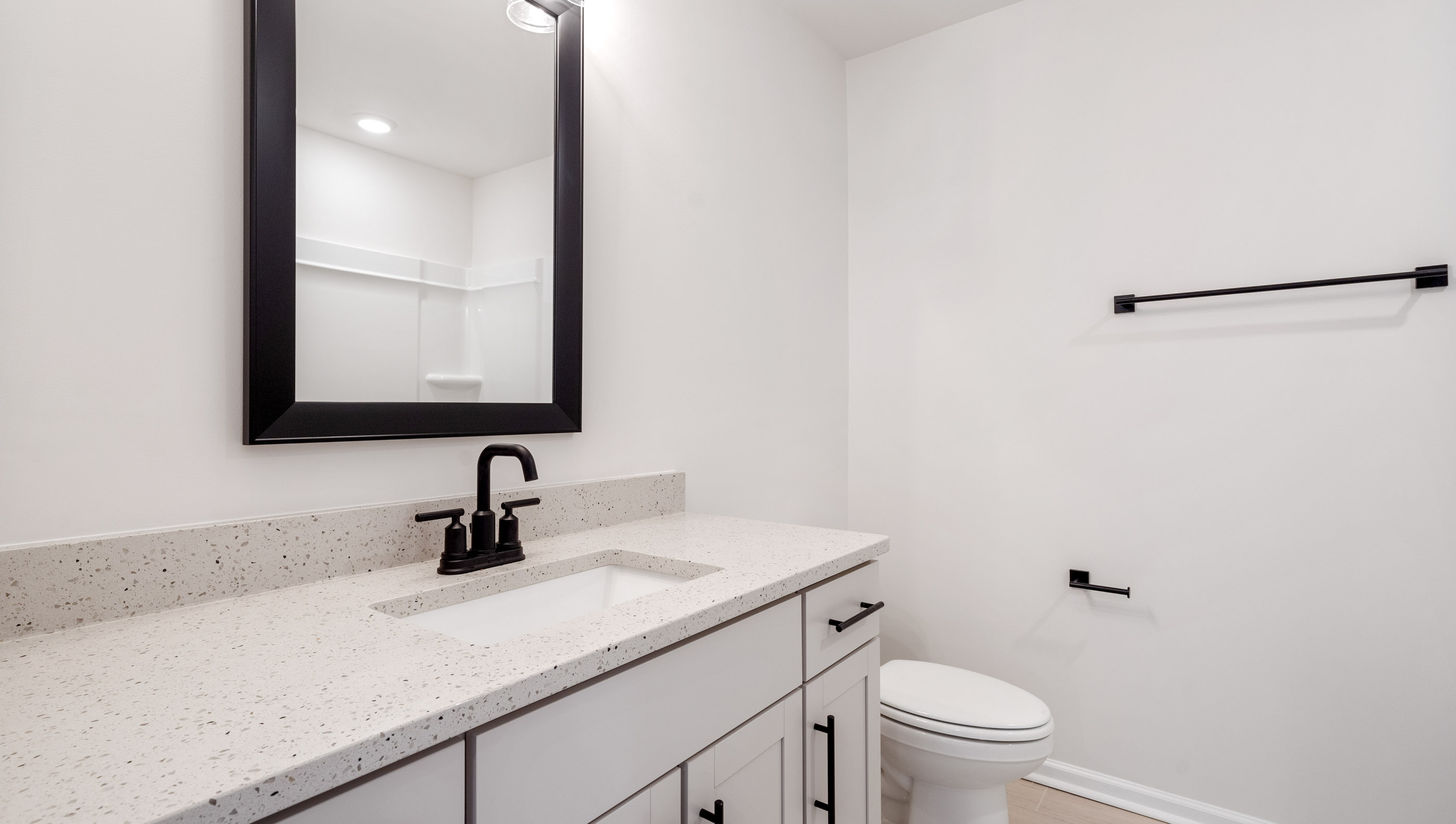 Hall bathroom with vanity.