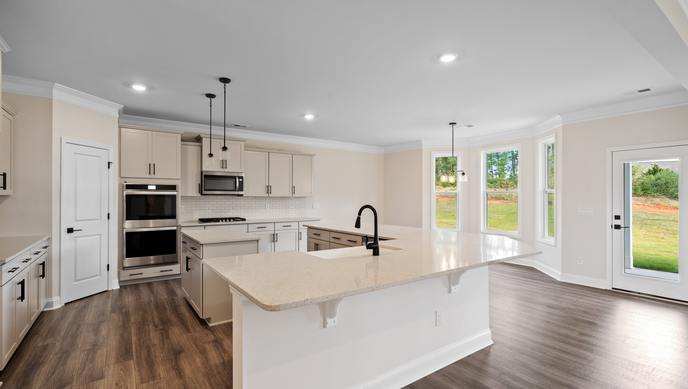 Large island hosts the sink and dishwasher.