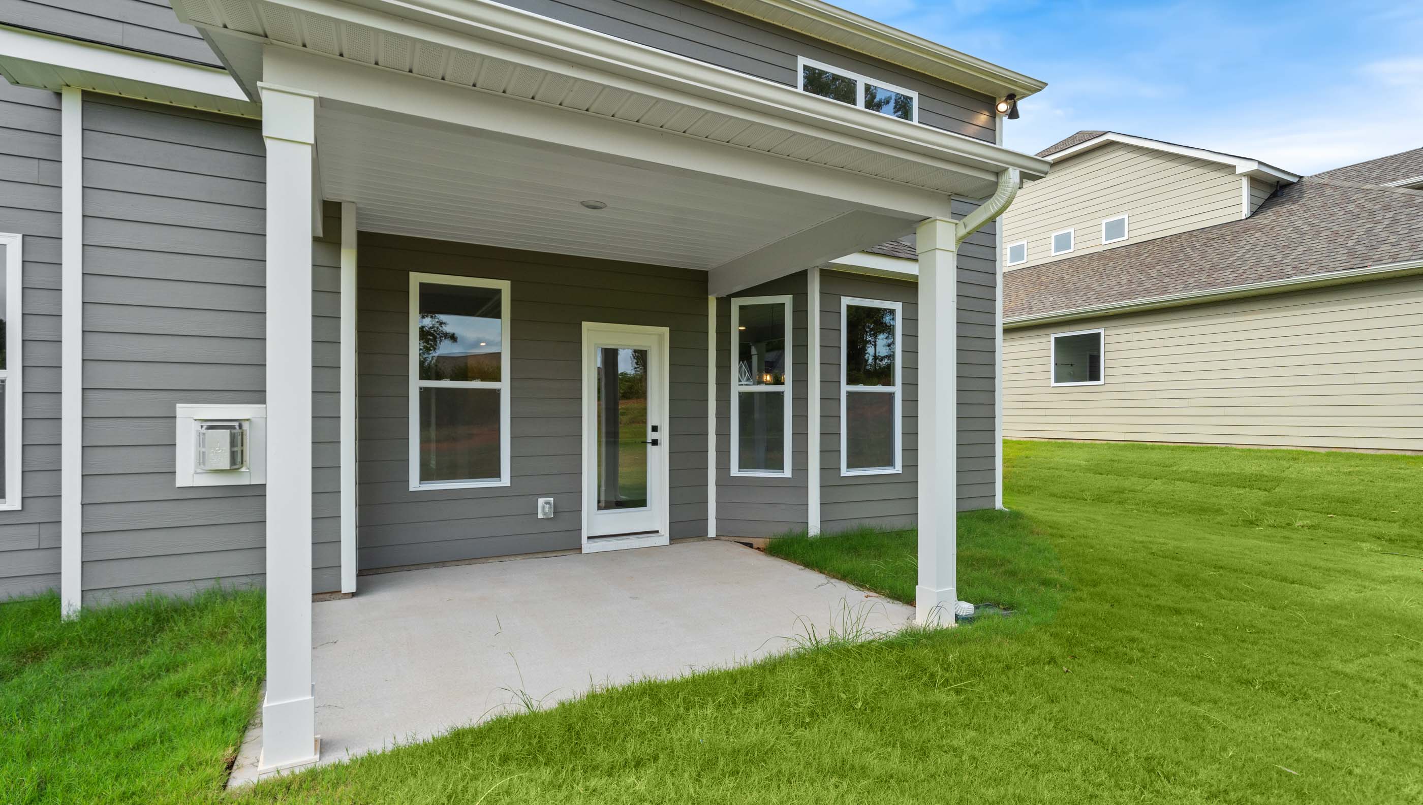 Back exterior with large backyard.