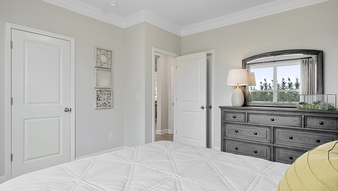 Bedroom with carpet and window.