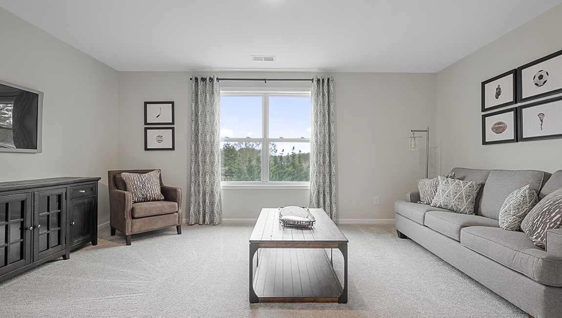 Bedroom with carpet and window.