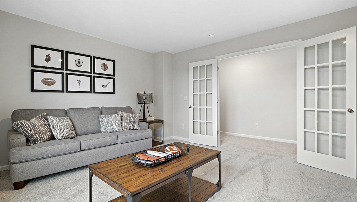Bedroom with carpet and window.