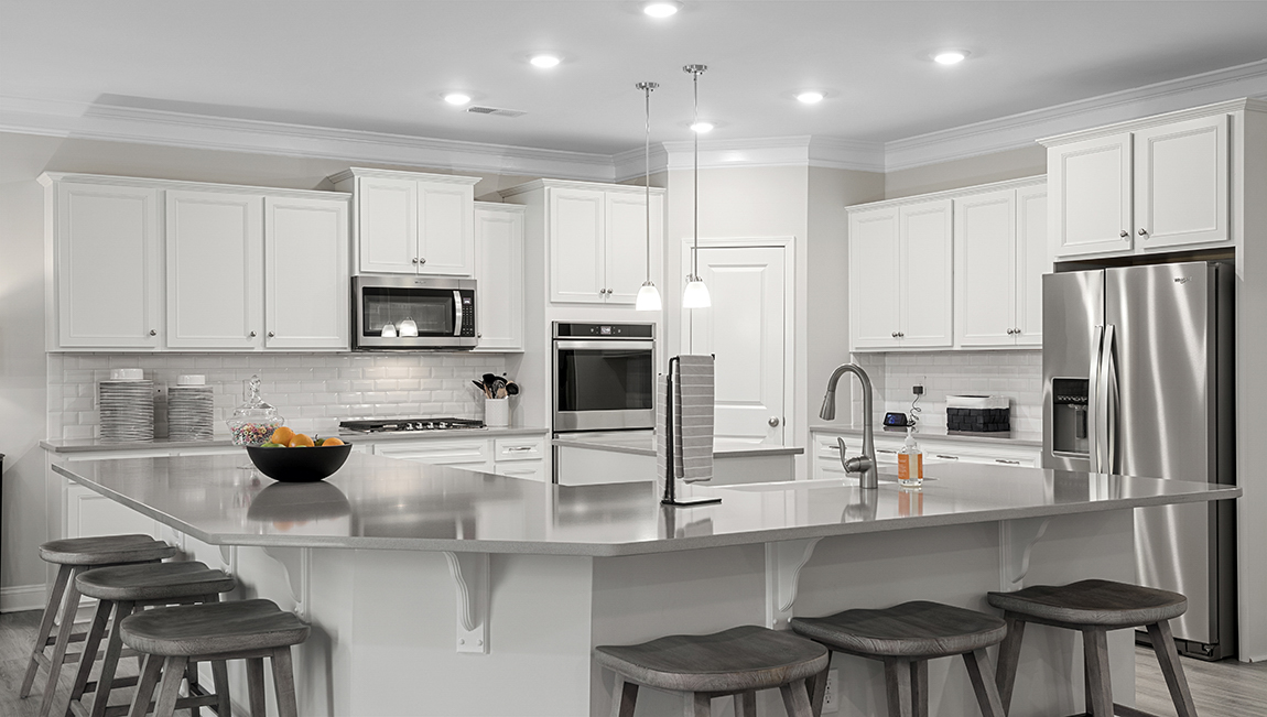 Kitchen with island and cabinets.