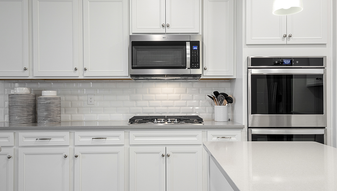 Kitchen with island and cabinets.