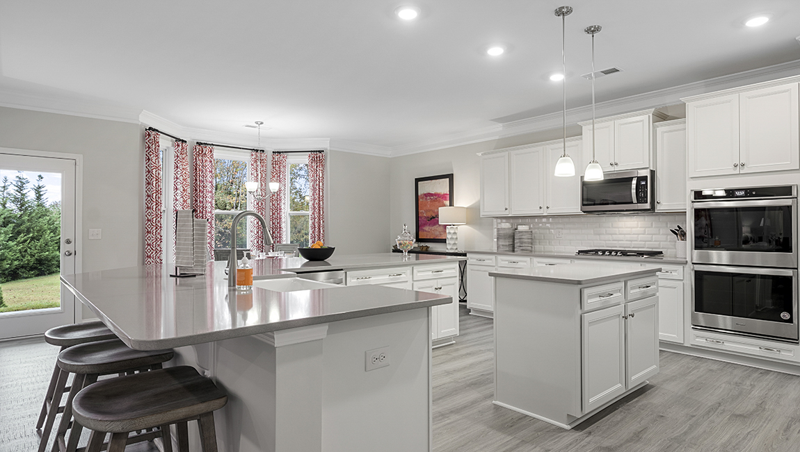 Kitchen with island and cabinets.