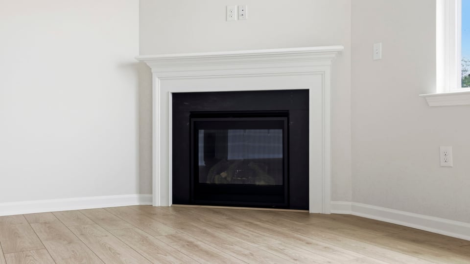 Living area with windows and fireplace.