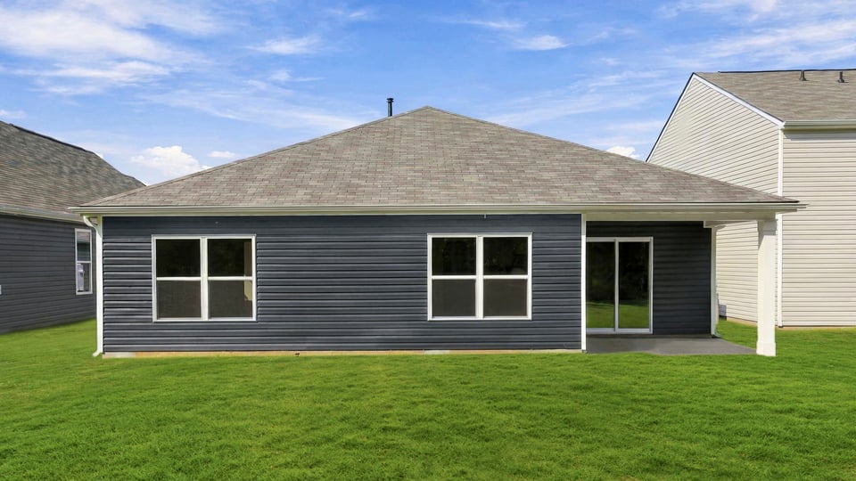 Back exterior with large backyard.