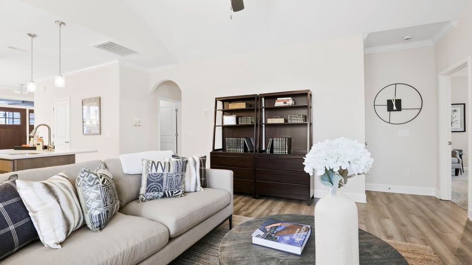 Living area with fireplace and windows.