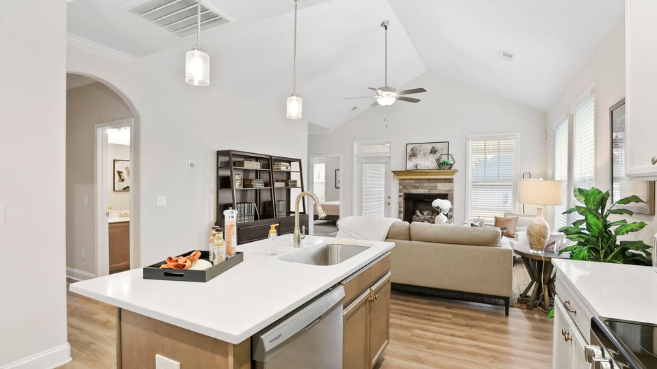 Living area with fireplace and windows.
