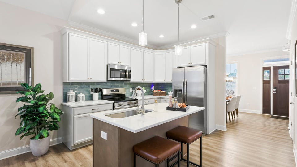 Kitchen with island and cabinets.