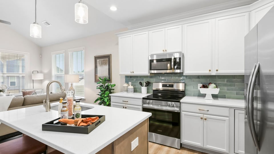 Kitchen with island and cabinets.