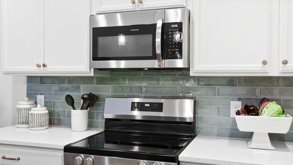 Kitchen with island and cabinets.