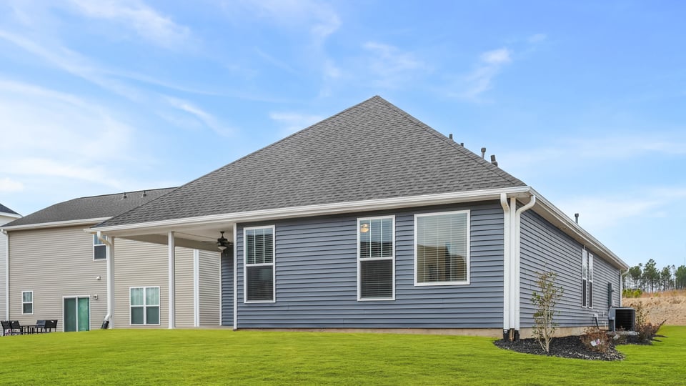 Back exterior with large backyard.