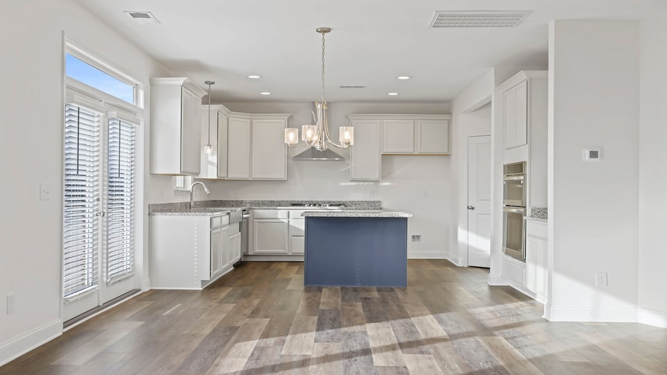 Kitchen with island and cabinets.