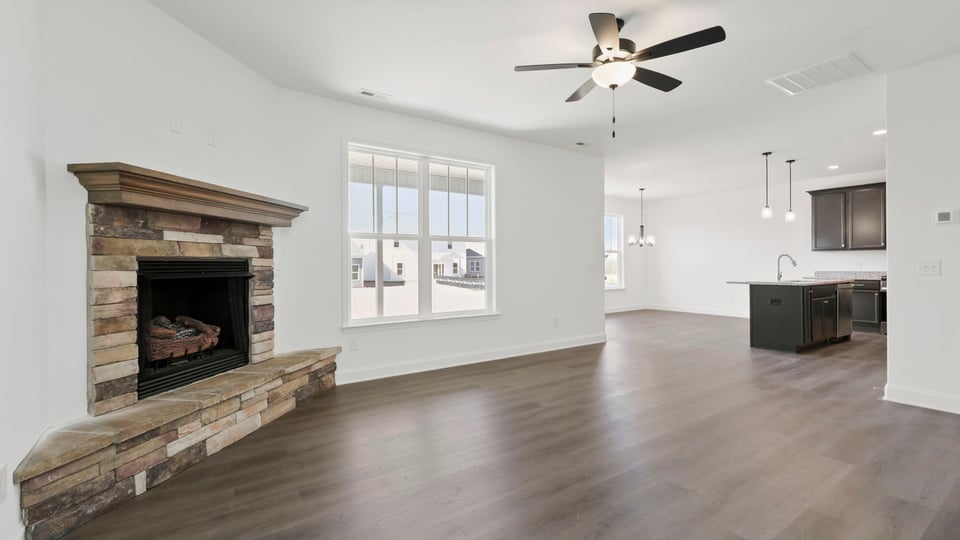 View from the family room toward the kitchen and dining area.