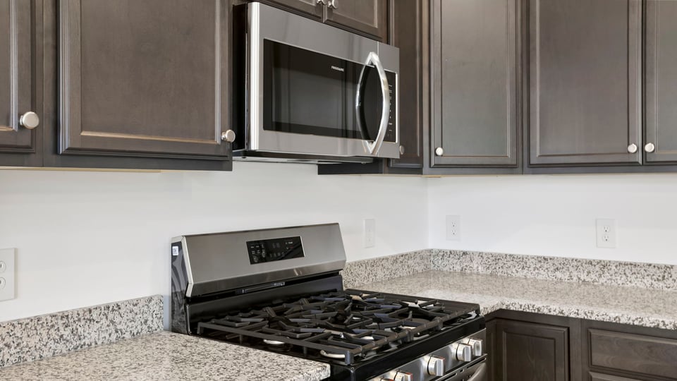 Gas range and built in microwave.