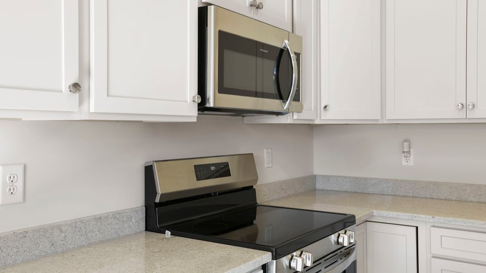 Kitchen with island and cabinets.