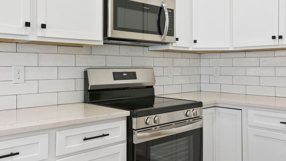 Kitchen with island and cabinets.