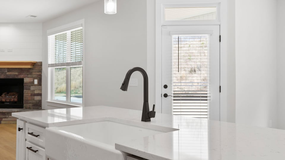 Kitchen with island and cabinets.