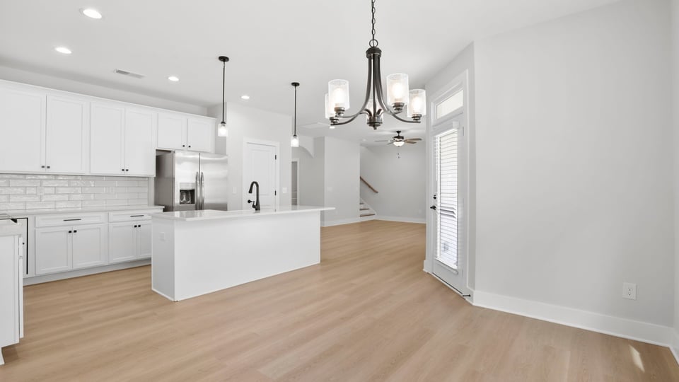 Kitchen with island and cabinets.