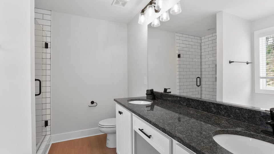 Primary bathroom with double vanity sinks.