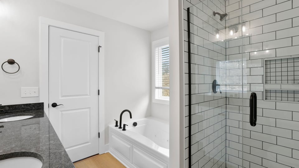 Primary bathroom with double vanity sinks.