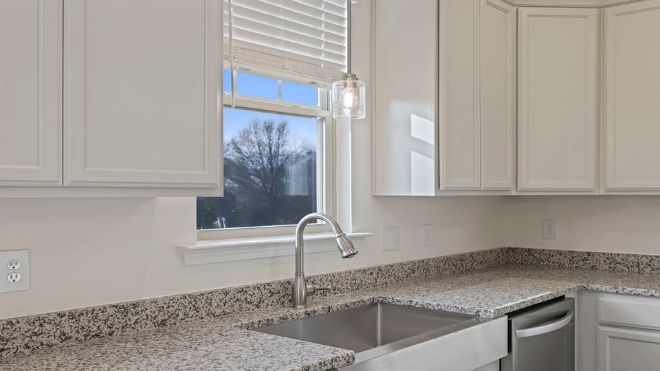 Kitchen with island and cabinets.