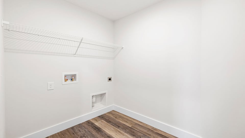 Laundry room with shelf.