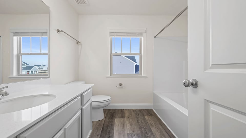 Bathroom with window and sink.