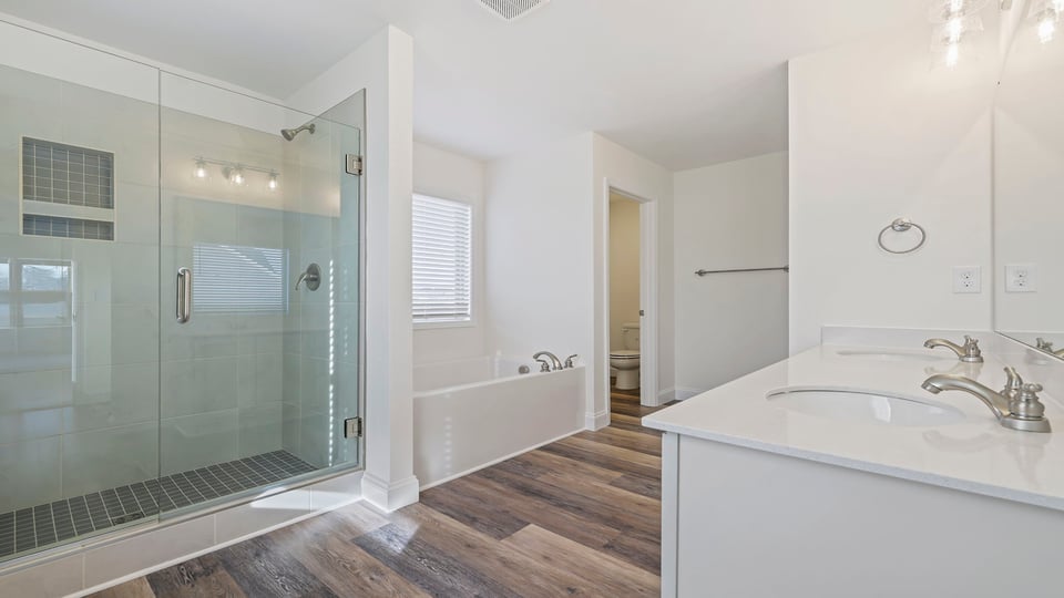 Primary bathroom with double vanity sinks.
