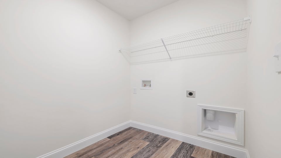 Laundry room with shelf.