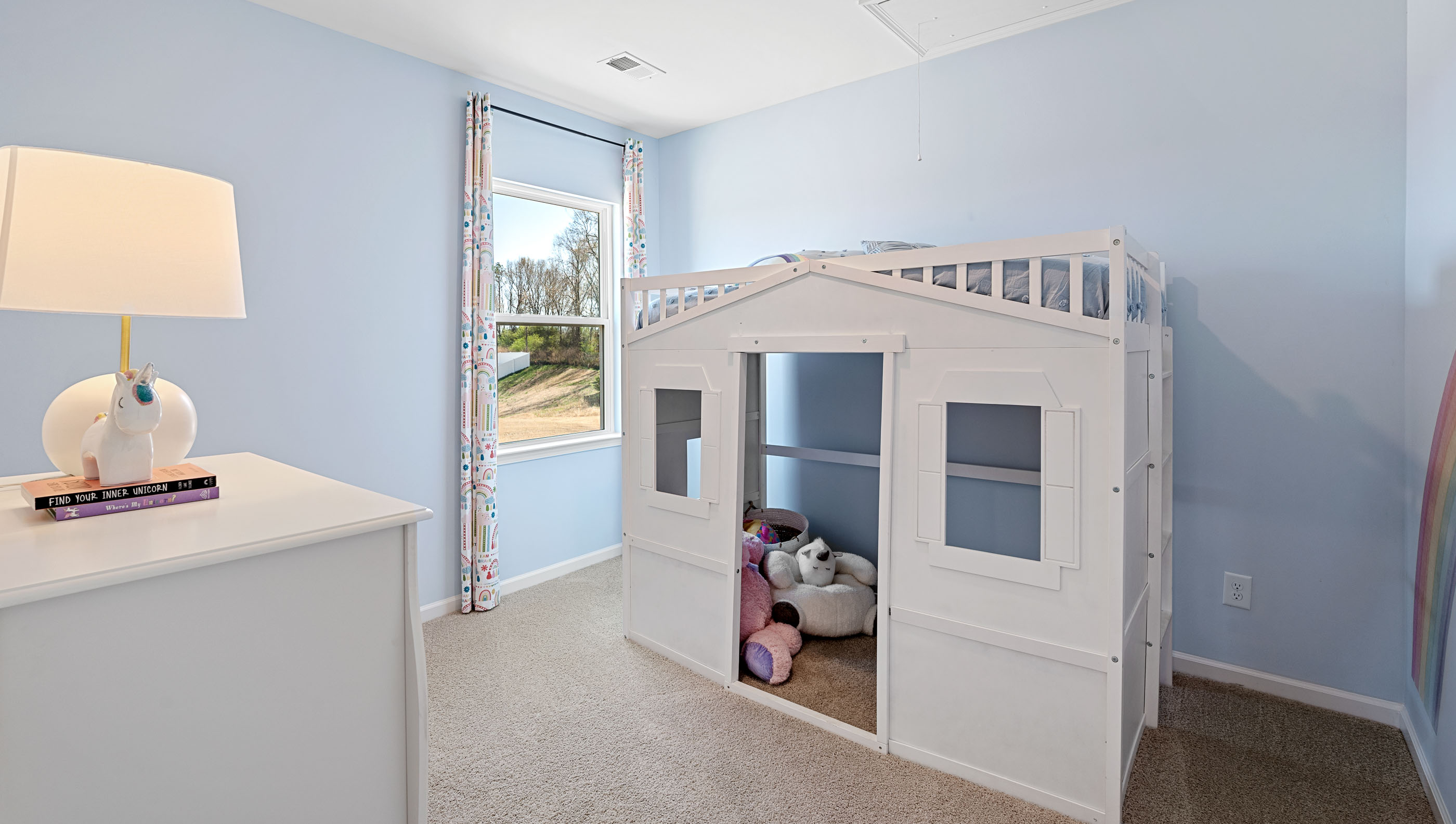 Bedroom with carpet and window.