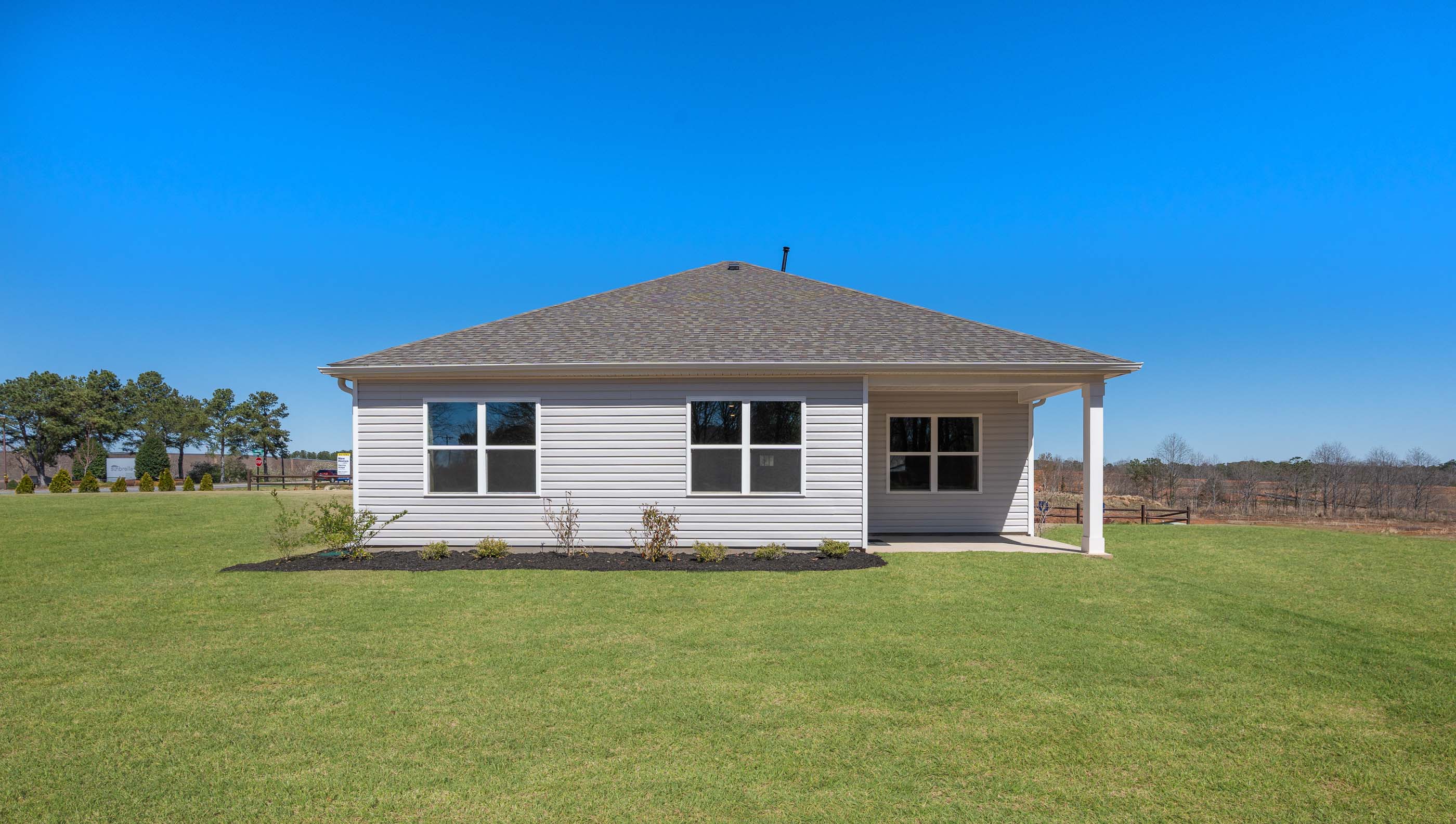 Back exterior with large backyard.