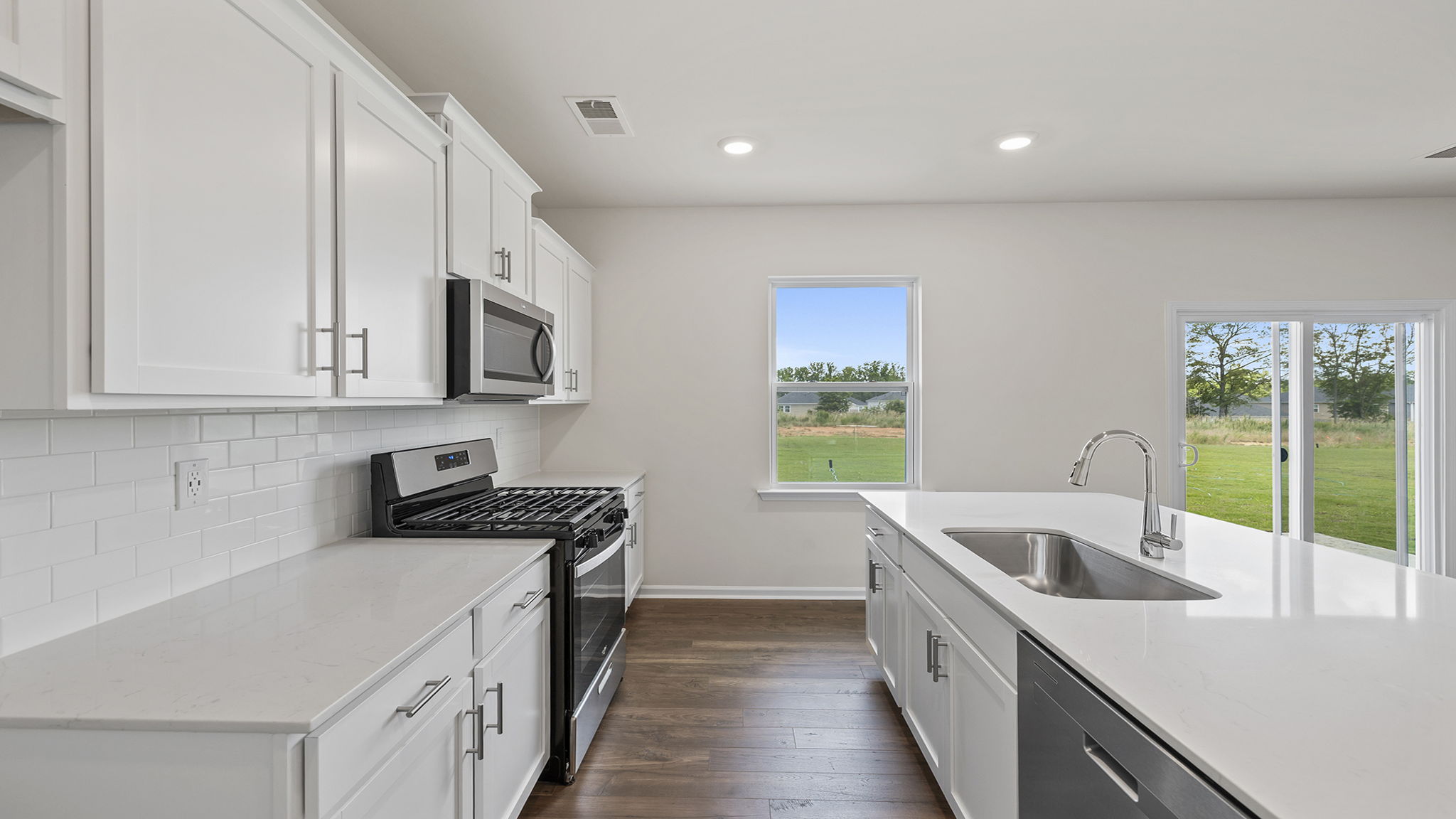 Kitchen with island and cabinets.