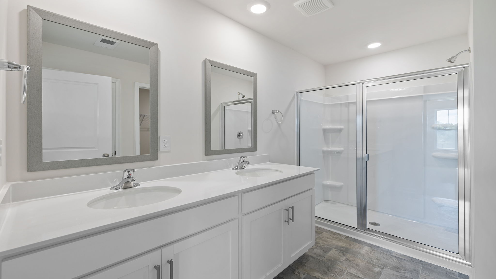 Primary bathroom with double vanity sinlks.