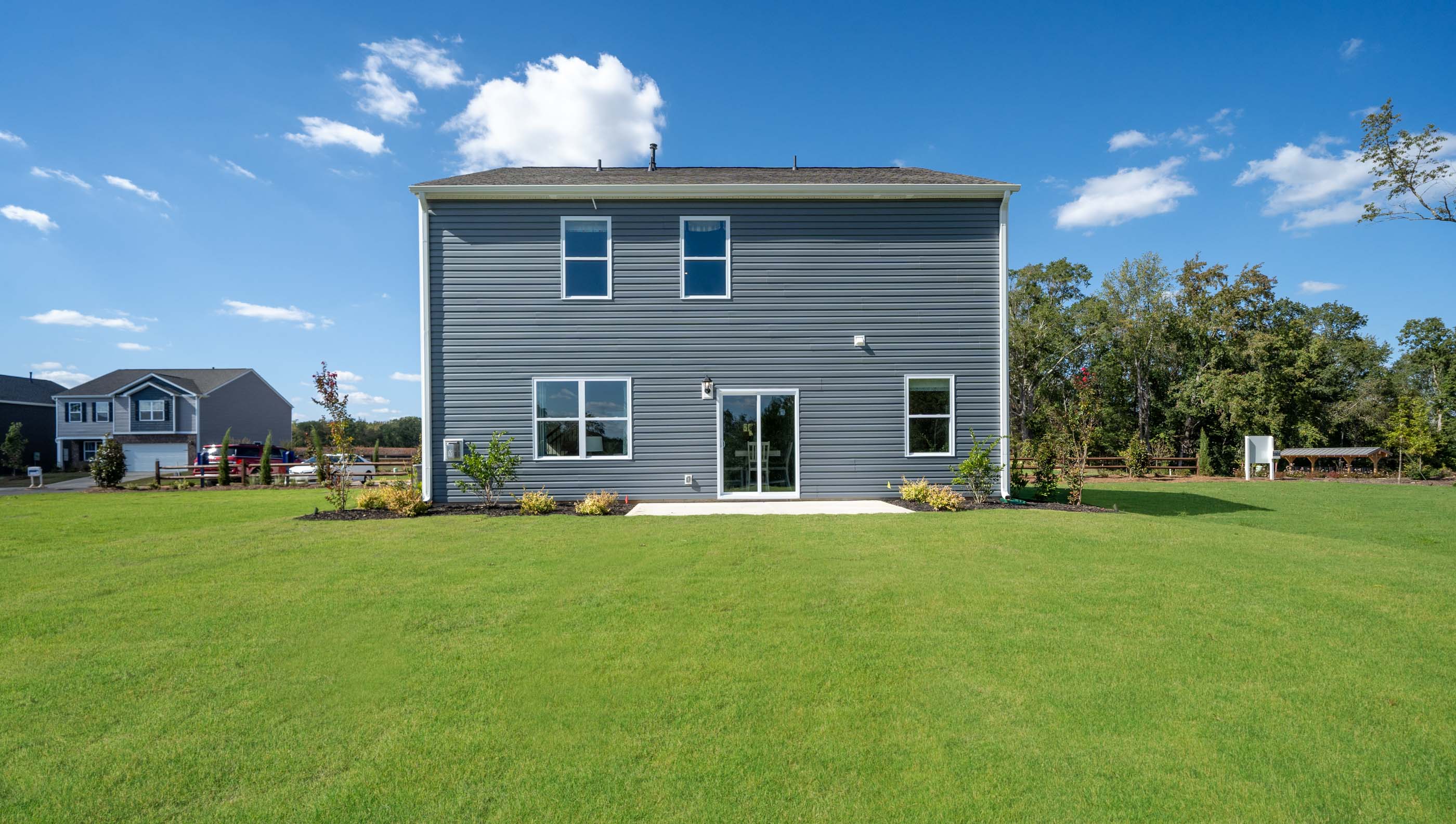 Back exterior with large backyard.