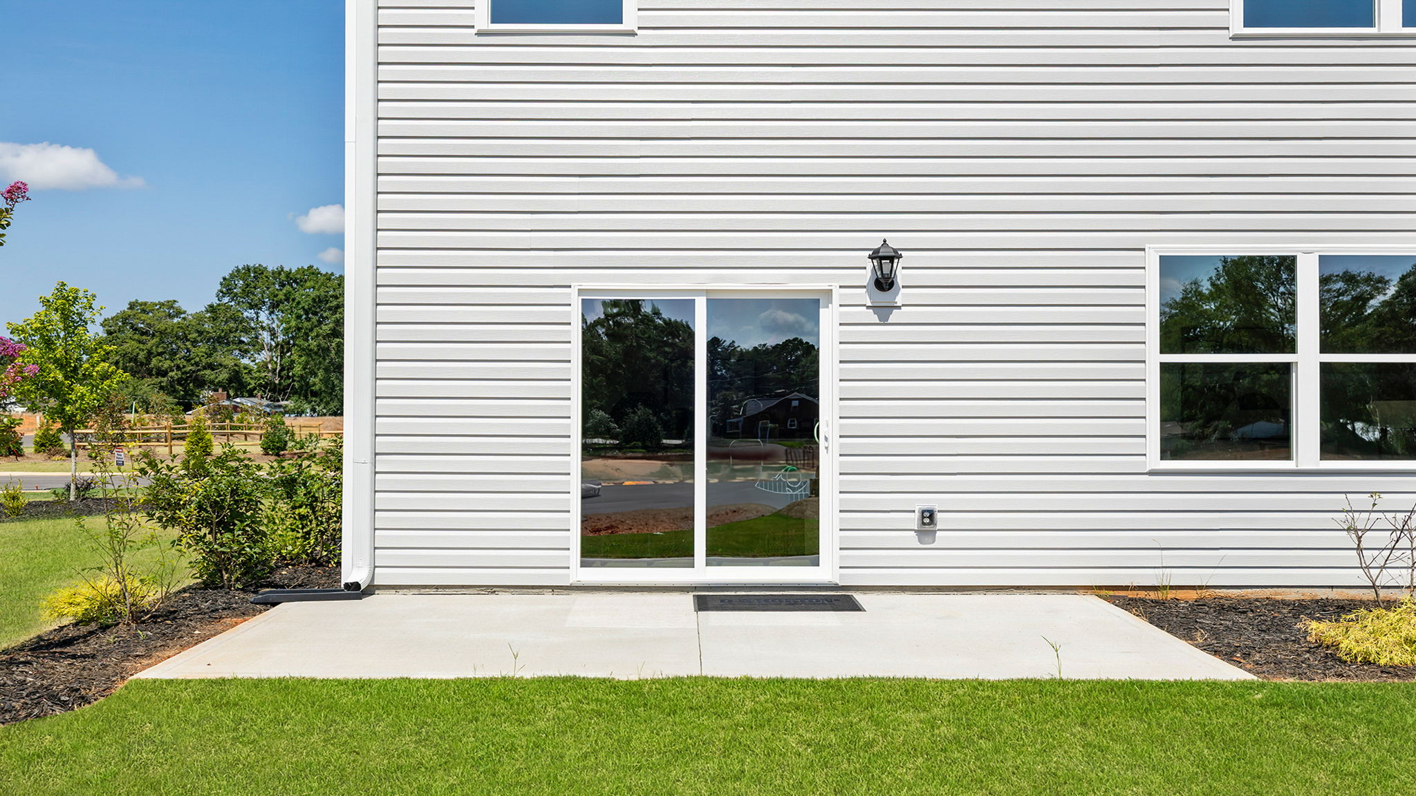 Back exterior with large backyard.