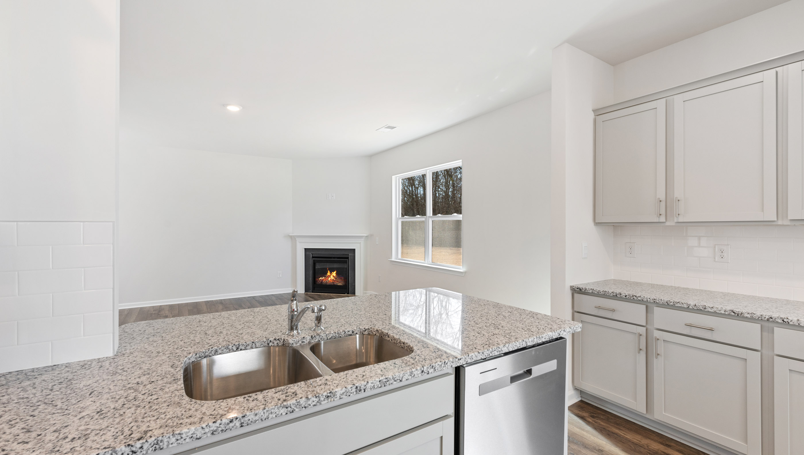 Kitchen with island and cabinets.
