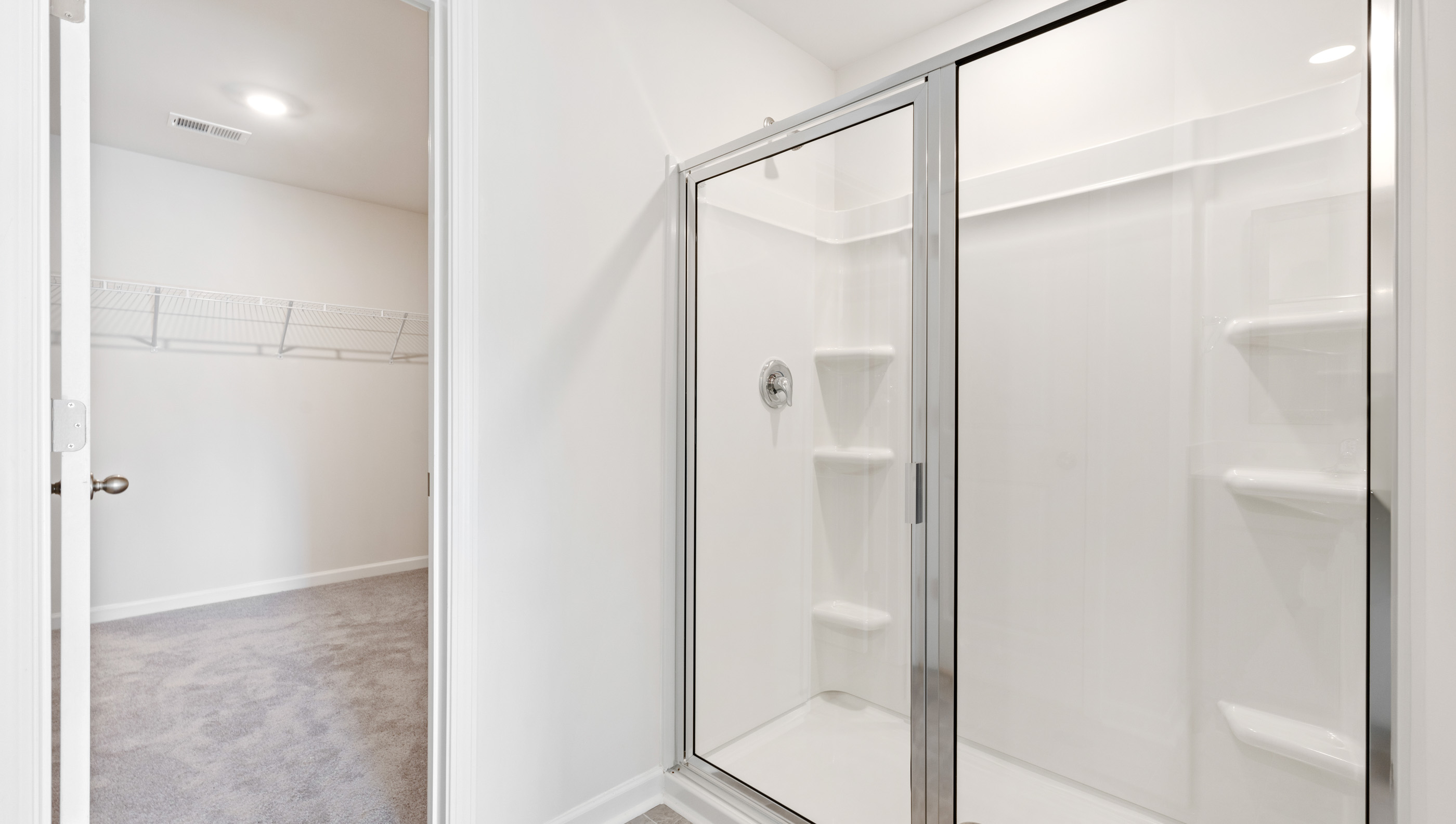 Primary bathroom with double vanity sinks.