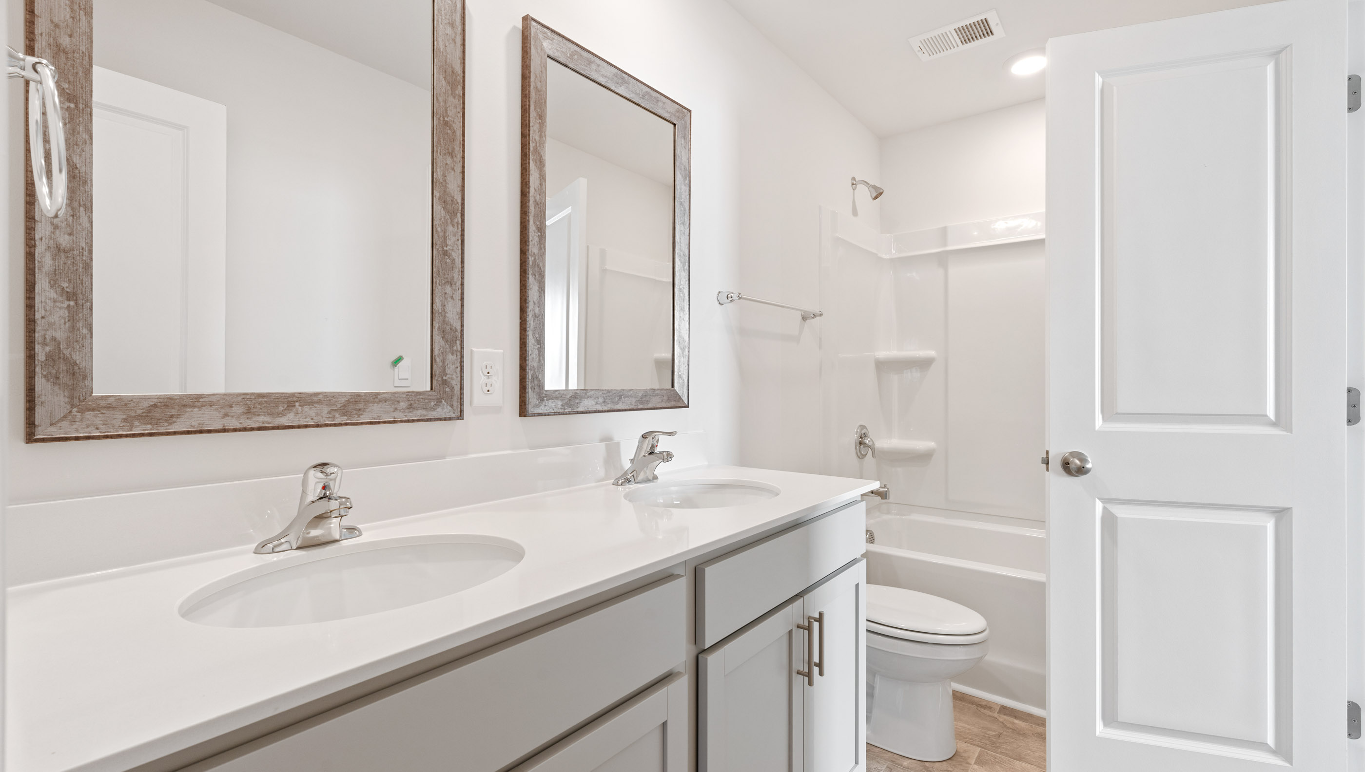 Bathroom with double vanity sinks.