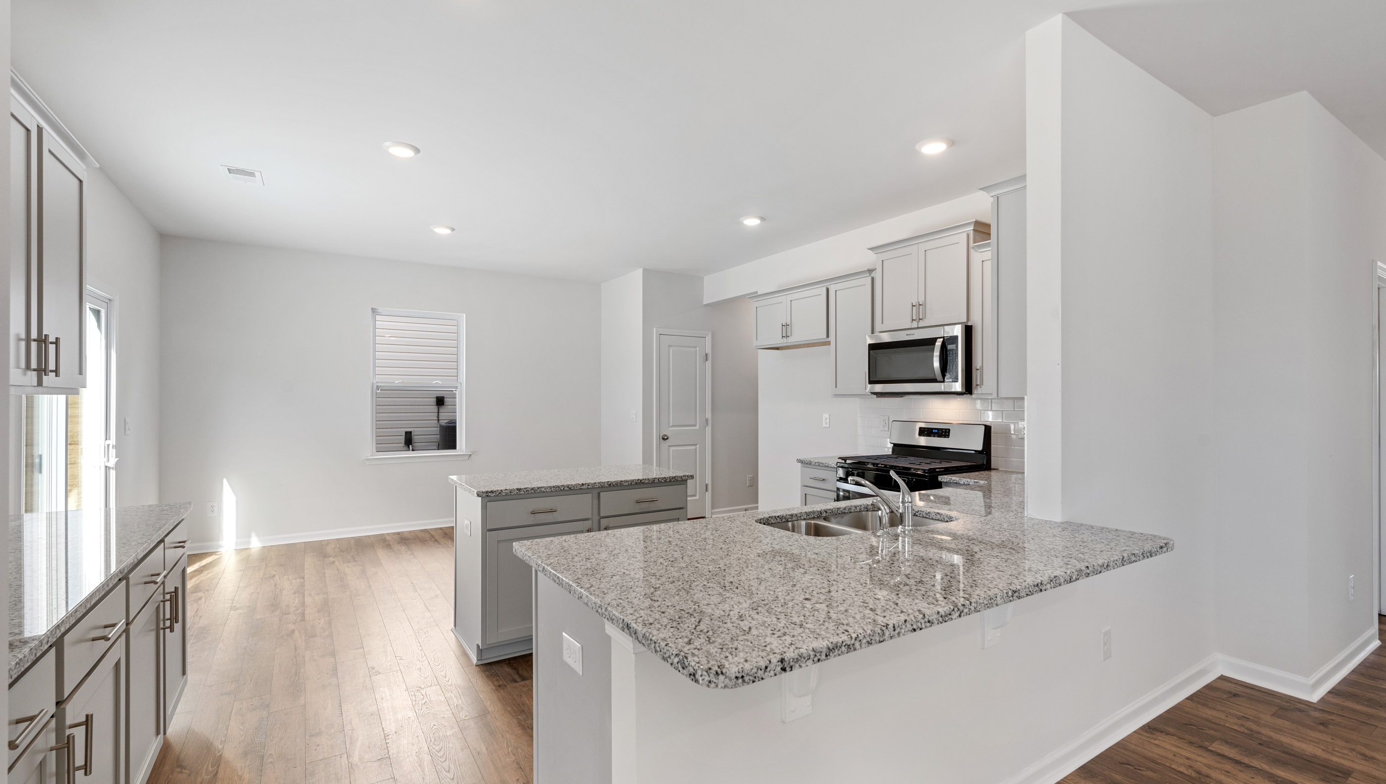 Kitchen with island and cabinets.