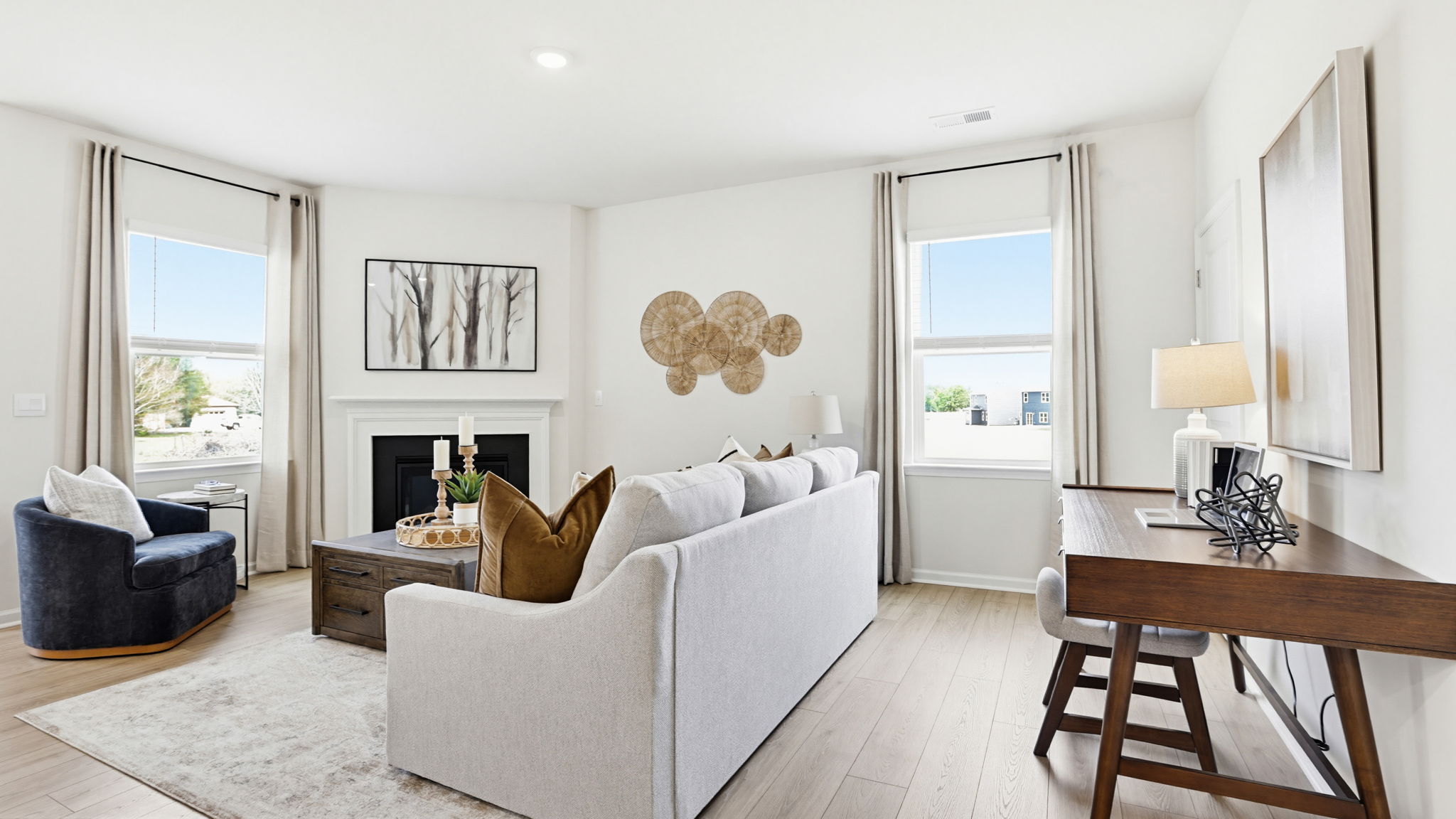 Family room with fireplace and windows.