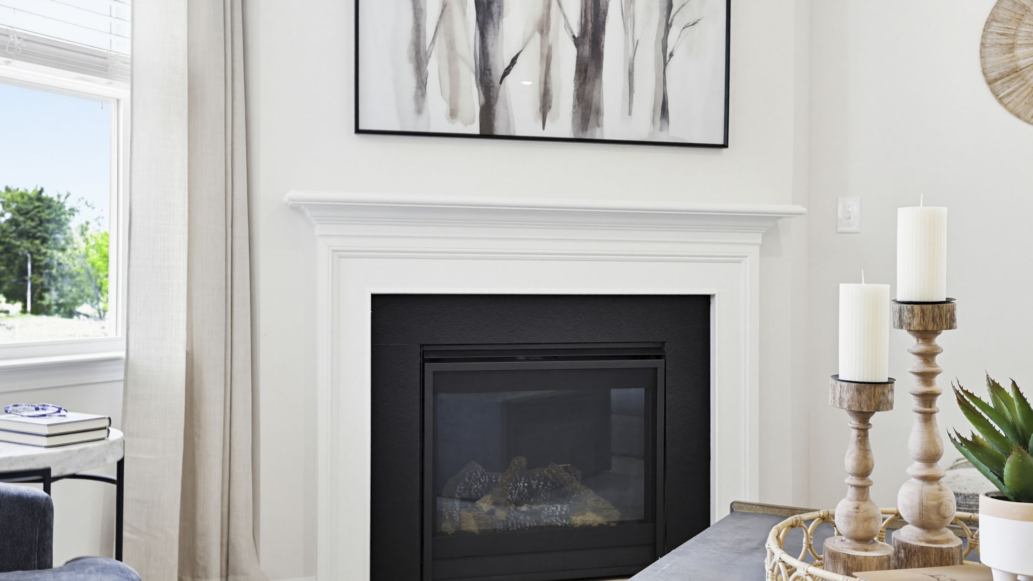 Family room with fireplace and windows.