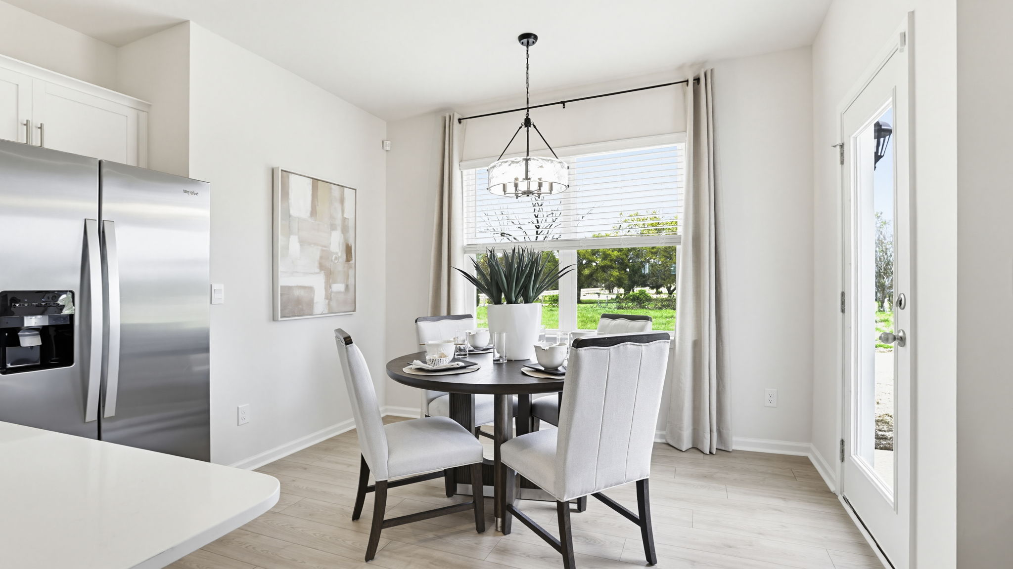 Family room with fireplace and windows.