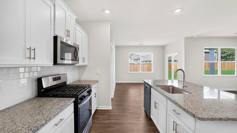 Kitchen with island and cabinets.